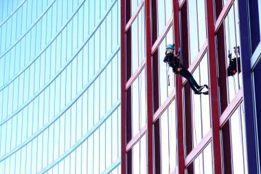 Laughing at gravity (and lunch) during a 400-foot rappel down the Rio. 