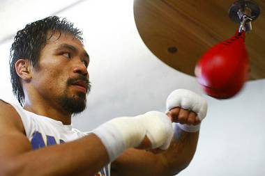 Manny Pacquiao hits a speedbag during a workout at Wildcard Boxing Club in Hollywood, Calif., on Nov. 8, 2010. Pacquiao takes on Antonio Margarito at Cowboys Stadium in Arlington, Texas, on Nov. 13. 