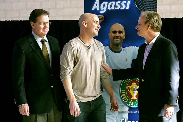 Andre Agassi talks with International Tennis Hall of Fame Chairman Christopher Couser, right, and CEO Mark Stenning after an announcement of Agassi's induction into the International Tennis Hall of Fame on Thursday, Jan. 20, 2011, at the Andre Agassi College Preparatory Academy. Agassi will be officially inducted July 9.