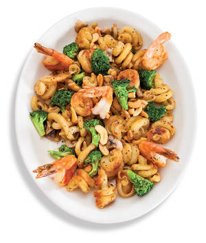 Pan-seared trottole pasta with shrimp, mushrooms and broccoli. 