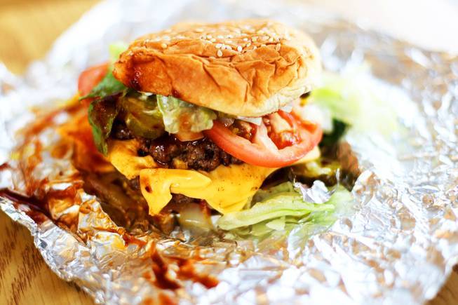 A burger with everything is photographed at the new Five Guys Burgers and Fries on Eastern Avenue in Henderson on Wednesday, March 2, 2011.