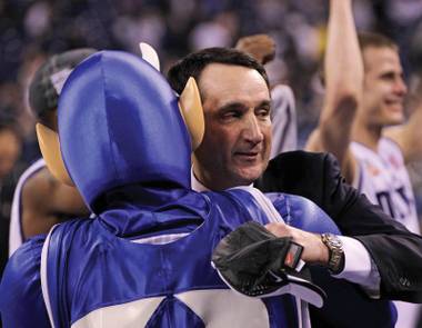 Dancing with the devil: Duke coach Mike Krzyzewski celebrates his team’s 2010 NCAA title.