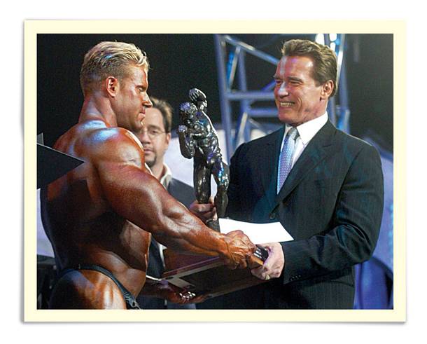 California Gov. Arnold Schwarzenegger presents the Arnold Classic winner's trophy to bodybuilder Jay Cutler, left, in Columbus, Ohio, Saturday, March 6, 2004, during The Arnold Fitness Weekend, an annual bodybuilding and fitness expo held in Columbus since 1989.