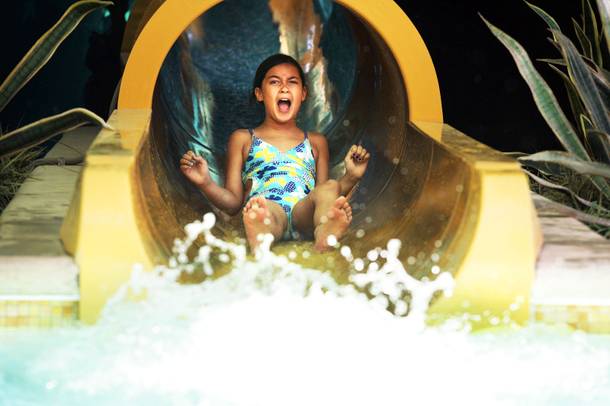 Fuatino Peko-Hansell, 9, of Las Vegas screams as she exits the slide that goes through the shark tank at the pool at the Golden Nugget in downtown Las Vegas Wednesday, July 13, 2011.