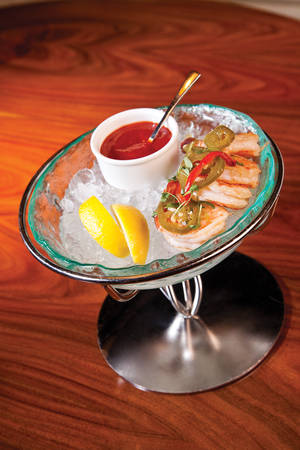 The shrimp cocktail is deliciously askew--lightly pickled and spiced prawns served with a peppy cocktail sauce.