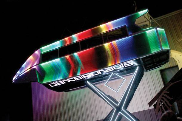 The Dancetronauts' mobile spaceship lights up the sky.