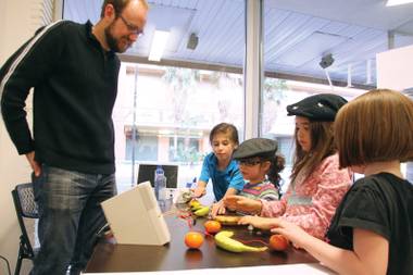 Kids learn to harness the power of a banana at Syn Shop. 