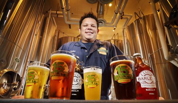 Barley's brewmaster, Bubba, shows off his crop of beers.