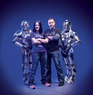 Amanda Deacon and Ian Herrington with a pair of their part-human, part-machine Showbots.