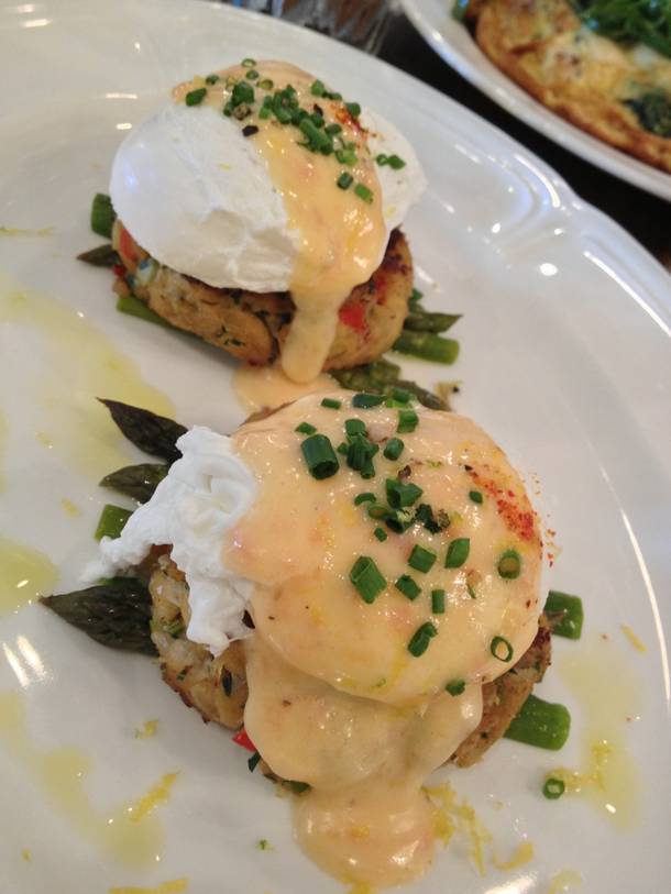 Honey Salt's crab cake benedict comes with asparagus, poached eggs and tomato Hollandaise. 