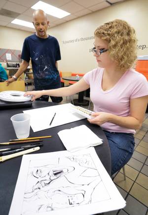 Nikki Paskevicius prepares a painting during a Saturday morning art class at Shannon West Homeless Youth Center.
