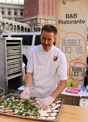 Chef Jason Neve, culinary director of Mario Batali's three Las Vegas restaurants, prepares burrata crostini with spring vegetables at UNLVino's Bubble-Licious event.