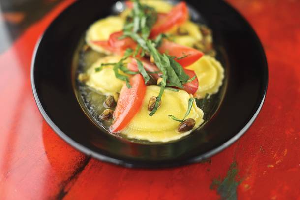Pasta Shop's Raviola Bianca, delicate cheese ravioli in brown butter with fresh basil, roma tomatoes and roasted pistachios.
