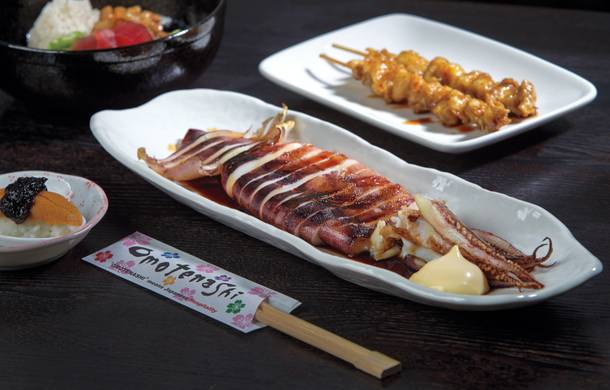 Whole grilled squid plus chicken skin skewers add up to a delicious nosh at Izakaya Cocokala.
