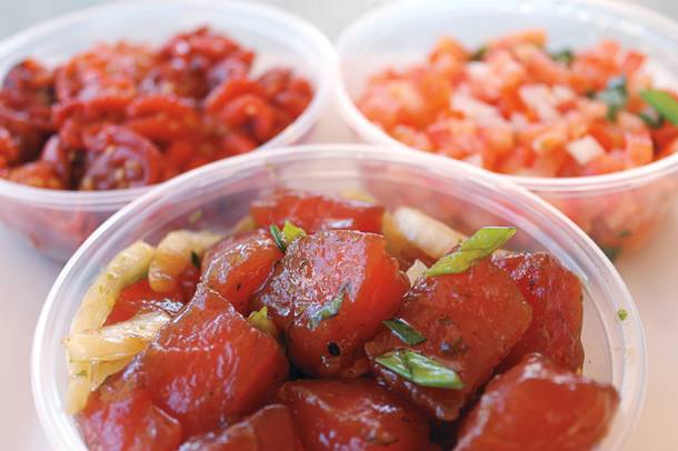 Clockwise from front: ahi poke with oyster sauce; the marinated baby octopus known as chuka iidako; and lomi lomi salmon, all at Poke Express.