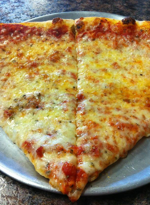 Two slices of cheesy thin-crust goodness at New York Pizza & Pasta.