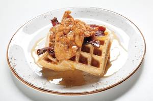 Chicken and waffles (and bacon) at Della's Kitchen, the new restaurant at Delano.