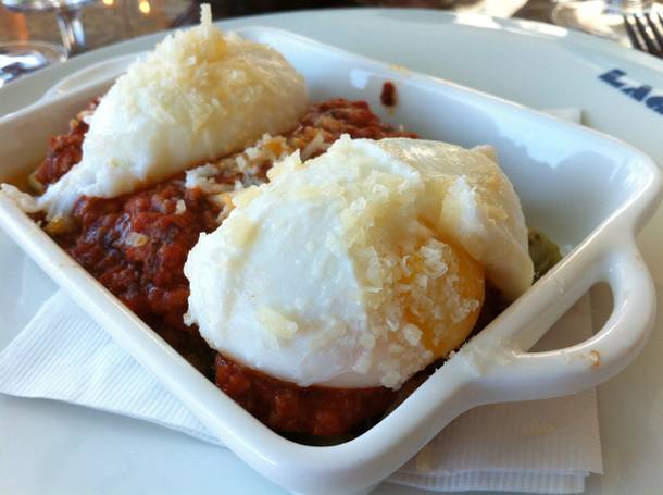 Lago's poached egg-topped lasagna with meat sauce.
