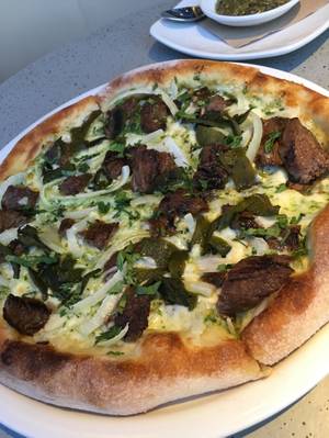 The carne asada pizza is the most popular pie at the Park location.