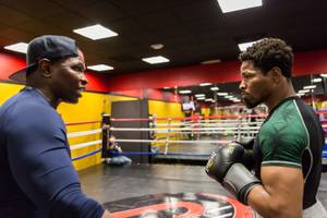 Boxer and former IBF welterweight champion Shawn Porter spars with his trainer Kenny Porter during a media workout at his gym, the Porter Hy-Performence Center, in Las Vegas, Nevada, June 8, 2016.