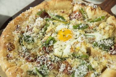The bacon and egg pizza—with grilled asparagus, roasted potato, garlic confit, rosemary and, of course, a fried egg—is perfect for sharing.