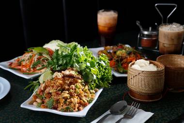 Clockwise from top: Lao-style papaya salad, chicken drunken noodles and nam lap tod.