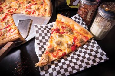 This Fremont Street pizzeria would be a destination even if all it offered were walls of Evel Knievel memorabilia
