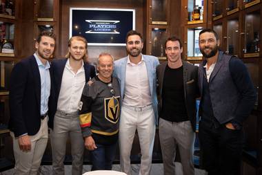 Celebrity chef Wolfgang Puck poses with Vegas Golden Knights players/partners (from left) Shea Theodore, William Karlsson, Alex Tuch, Reilly Smith and Deryk Engelland at the grand opening of Wolfgang Puck Players Locker in Summerlin. 