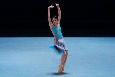 Betsy Lucas performs in ‘The Current,’ choreographed by Krista Baker, at the Smith Center stage, wearing her own designs.