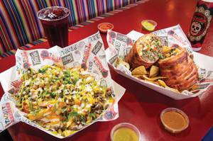 Carne asada fries and bacon-wrapped XL Burrito at Taquito Street