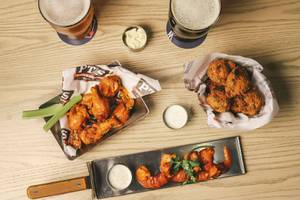 Add some hushpuppies and "Buffalo fins" to your order of wings at PT's sports bar at the STRAT.