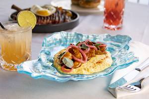 Shrimp and Grits, brioche French toast, Smoked Salmon with marinated cucumber and herbed cream cheese, and cocktails at Americana <em>(Yasmina Chavez/Staff)</em>
