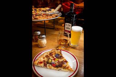 The pizza's ingredients have similar flavor profiles to Slane, counting on the robust nature of the whiskey to cut through the richness of the pie.
