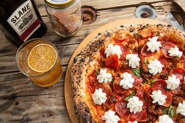 The pizza we are featuring with Slane Irish Whiskey is called The Stewart. This pie features a tomato sauce base with parmesan and fresh garlic slices, house-made spicy sausage, pepperoni and finished with fresh dollops of garlic whipped ricotta.