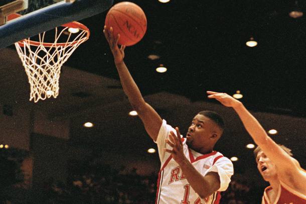 UNLV’s Anderson Hunt scores a basket as teammate Larry Johnson looks on during an NCAA Tournament first-round win over Montana on March 15, 1991.