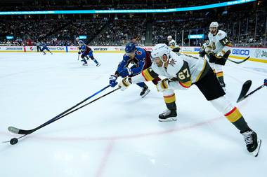 Vegas’ Max Pacioretty (67) fights for the puck with Colorado’s Valeri Nichushkin in Game 1 of the series.