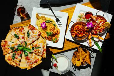 Taverna’s tapas platter with Rustico flatbread, rojo shrimp scampi and cocktails