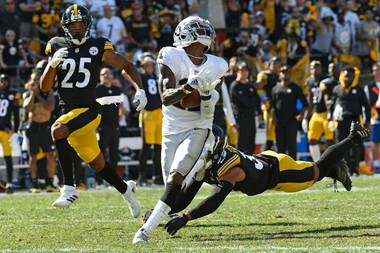 Raiders receiver Henry Ruggs (11) hauls in a touchdown pass from Derek Carr during the second half of the Raiders’ 26-17 victory over&nbsp;Pittsburgh.