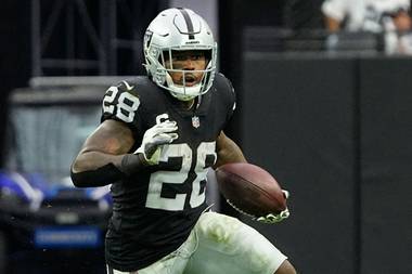 Raiders running back Josh Jacobs carries the ball against the Bears during the second half of the teams’ October 10 game at Allegiant&nbsp;Stadium.