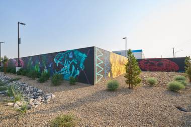 His 5,000-square-foot mural has a lot of story to tell, both about the community and the artist himself.