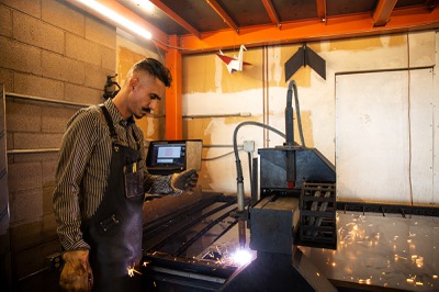 Metal artist Luis Valera-Rico  works on a project with a CNC Plasma Cutter at his shop Tuesday Oct. 25, 2021.