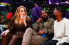 Singer Adele, left, and Rich Paul, center, attend an NBA basketball game between the Golden State Warriors and the Los Angeles Lakers in LA on October 19, 2021.


