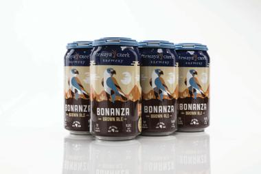 Tenaya Creek cans, designed by artist Kendrick Kidd, sport a deep blue band at the top that represents the desert sky, and a deep brown band at the bottom standing in for the desert floor.