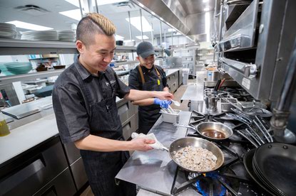 Chef Bryan Tejada, left, and cook Marion Sidon
