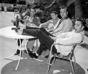 Elvis Presley with members of his band poolside at the New Frontier in 1956