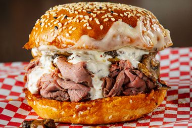 Run to the rich Horse & Hole sandwich and revel in umami from roasted mushrooms, horseradish cream, Provel cheese and a pile of the savory, sliced beef on a sesame bun.