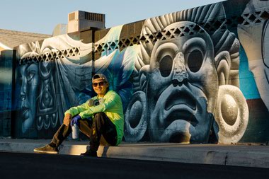 Muralist Juan Ochoa with his work at Crestline Drive & Elton Avenue 