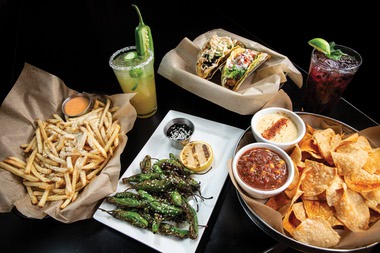 Tacos, queso and chips, shishito peppers, fries and cocktails at Craggy Range.