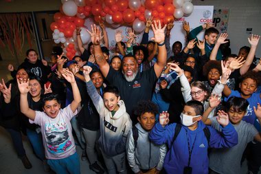 Core Executive Director Jeff Jones, center, with Brinley Middle School students during a pep&nbsp;rally