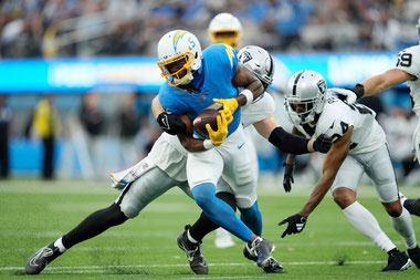 Los Angeles Chargers wide receiver Joshua Palmer runs after a catch against the Las Vegas Raiders on October 1 in Inglewood, California.